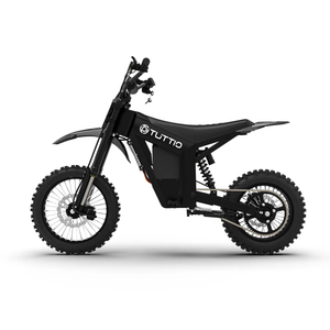 A black eBike Tuttio Soleil 01 SE electric bicycle with a step-through frame, front basket, rear rack, and upright handlebars, displayed on a white background.