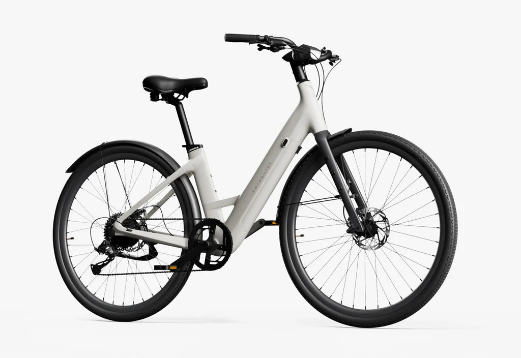 Side view of the Urtopia Carbon 1 Step Thru eBike in creme color, showcasing its lightweight carbon frame, step-through design, and sleek modern styling against a plain background.