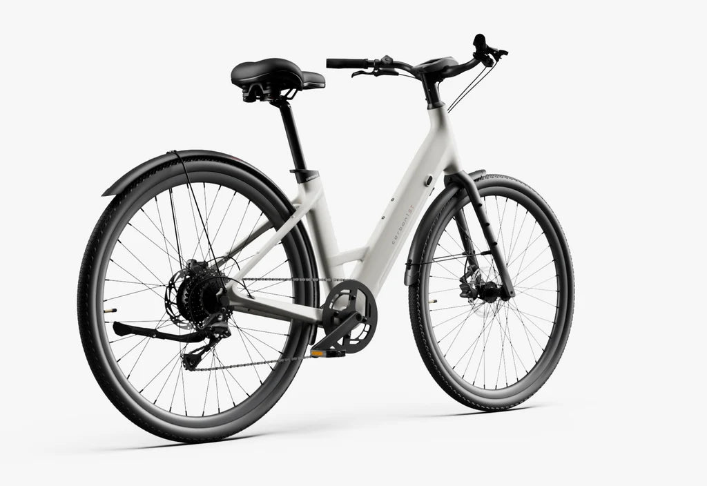 Side view of the Urtopia Carbon 1 Step Thru eBike in creme color, showcasing its lightweight carbon frame, step-through design, and integrated battery.