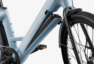 Urtopia Carbon 1 Step Thru eBike in Glacier Blue, side view showcasing lightweight carbon frame and step-through design