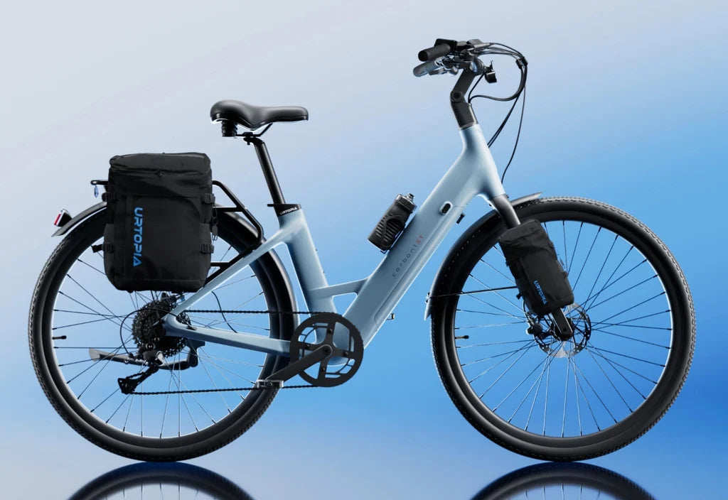 Side view of the Urtopia Carbon Classic Step Thru eBike in black, showcasing its lightweight carbon frame, step-through design, and integrated display on the handlebars.