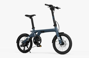 Aegean Blue Urtopia Carbon Fold 1 eBike, side view, folded for compact storage, showcasing lightweight carbon frame and modern design.