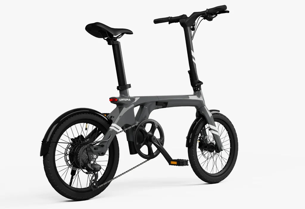 Side view of the Urtopia Carbon Fold 1 eBike in charcoal gray, showcasing its lightweight carbon frame, compact folding design, and sleek modern appearance.