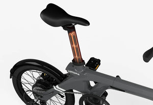 Side view of the Urtopia Carbon Fold 1 eBike in charcoal gray, folded for compact storage, highlighting its lightweight carbon frame and modern design.