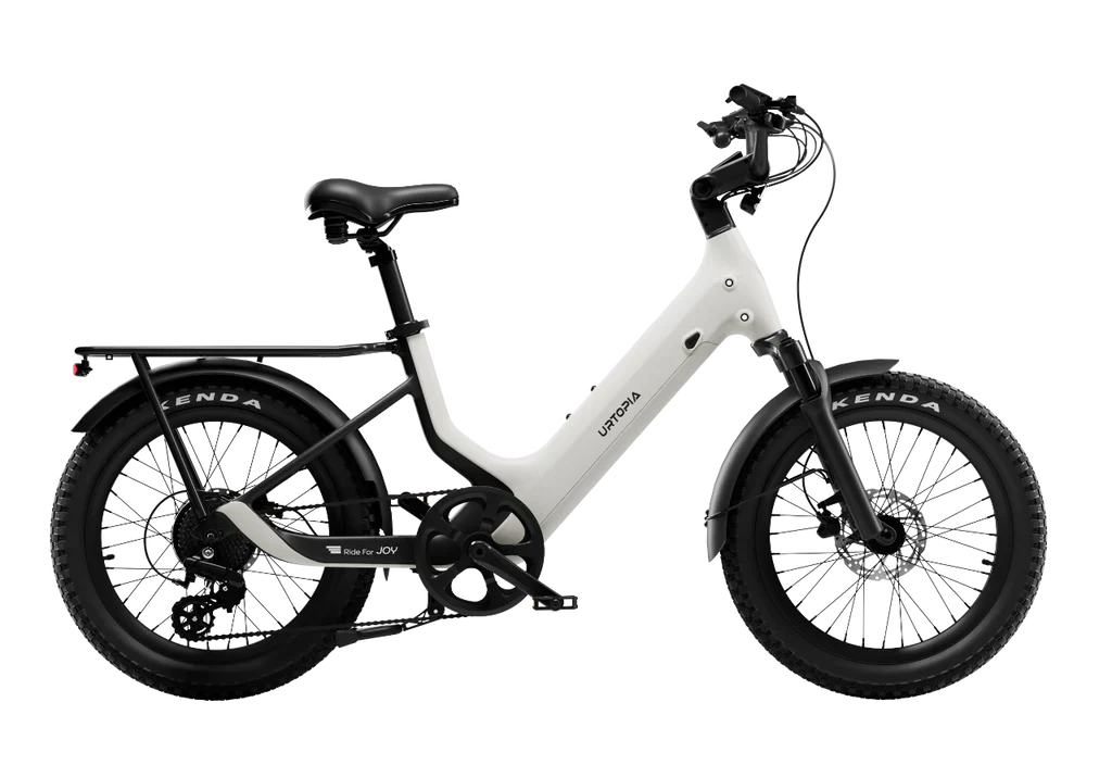 Urtopia Carbon Joy eBike in Creme color, side view, showcasing lightweight carbon frame and modern design.