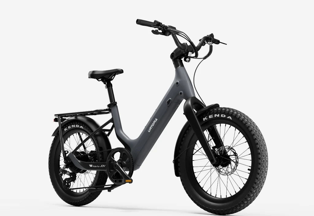 Side view of the Urtopia Carbon Joy Ultra eBike in charcoal gray, showcasing its sleek carbon fiber frame, integrated battery, and modern design against a plain background.