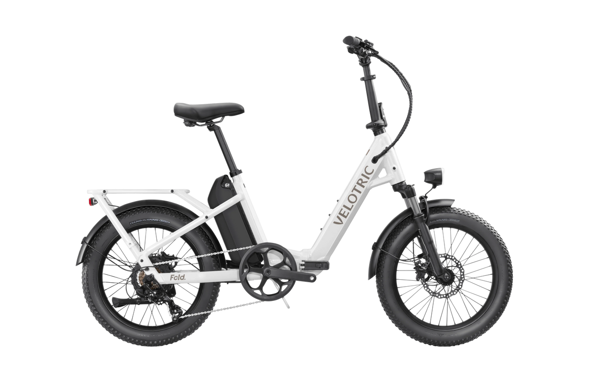 Pearl White Velotric Fold 1 eBike, folded, side view, against a plain background
