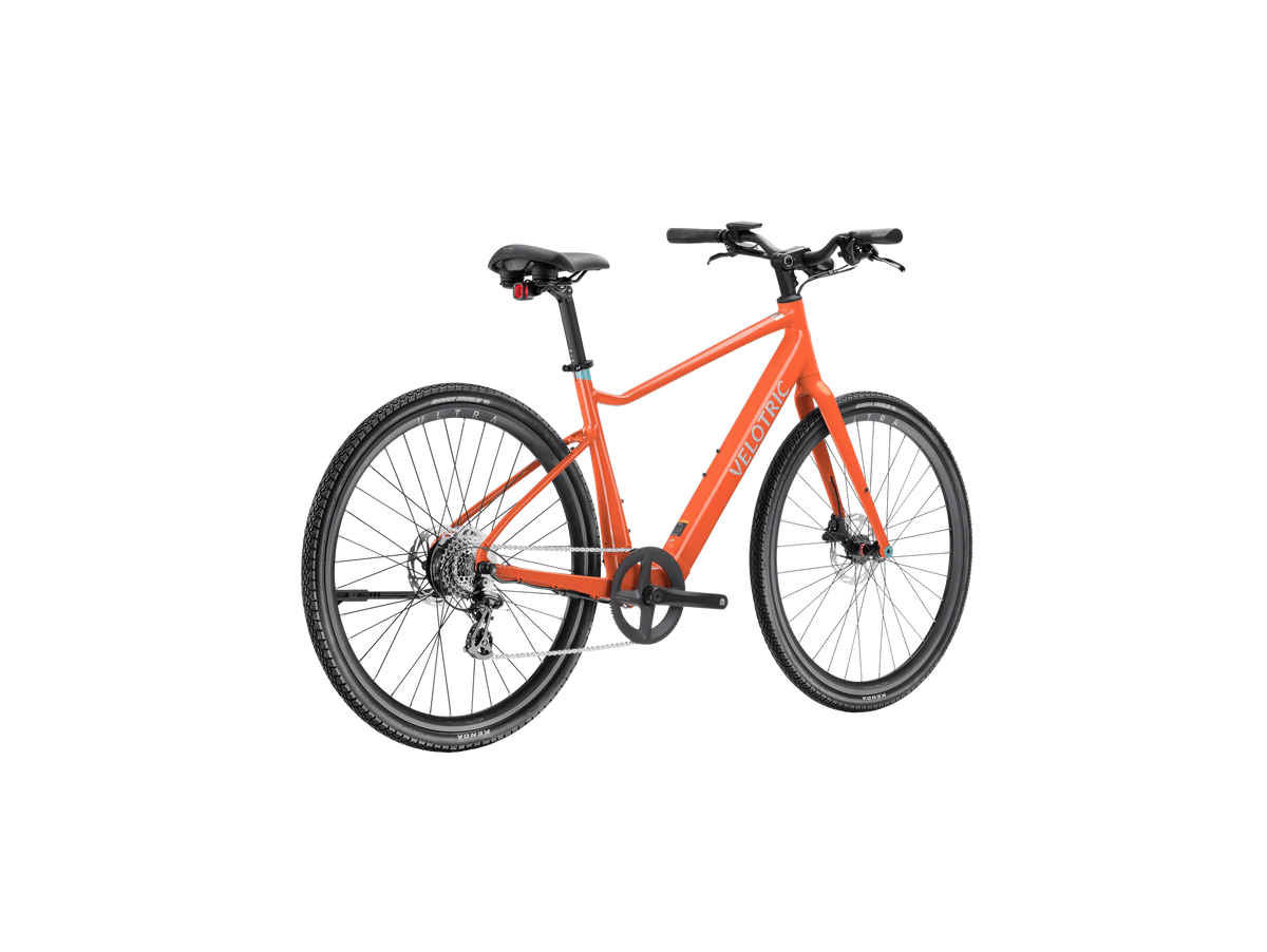 Velotric T1 ST Plus eBike in Lava color, side view, showcasing sleek frame and integrated battery
