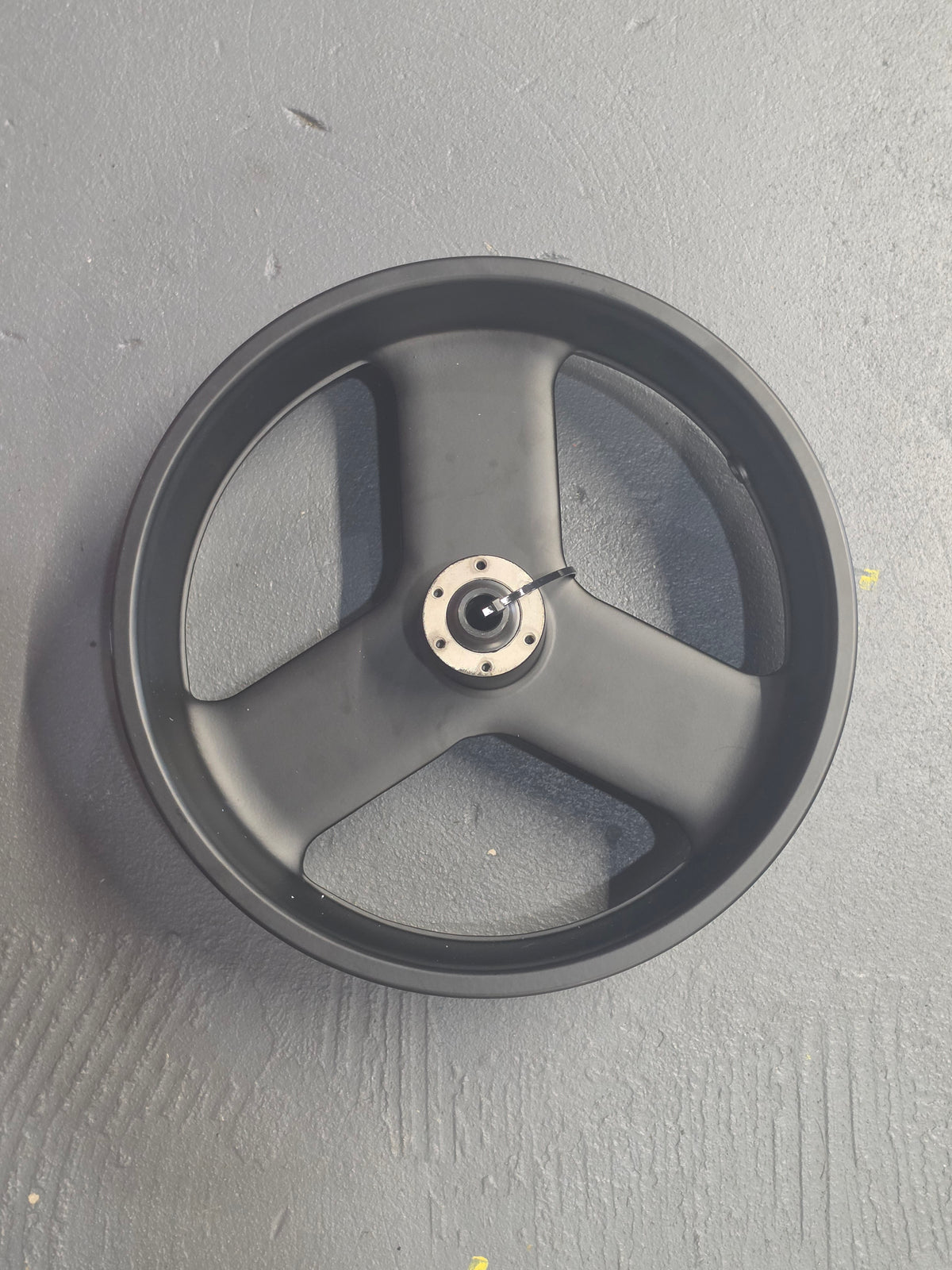 16-inch MZFT eBike front wheel with black spokes and silver hub, displayed against a white background