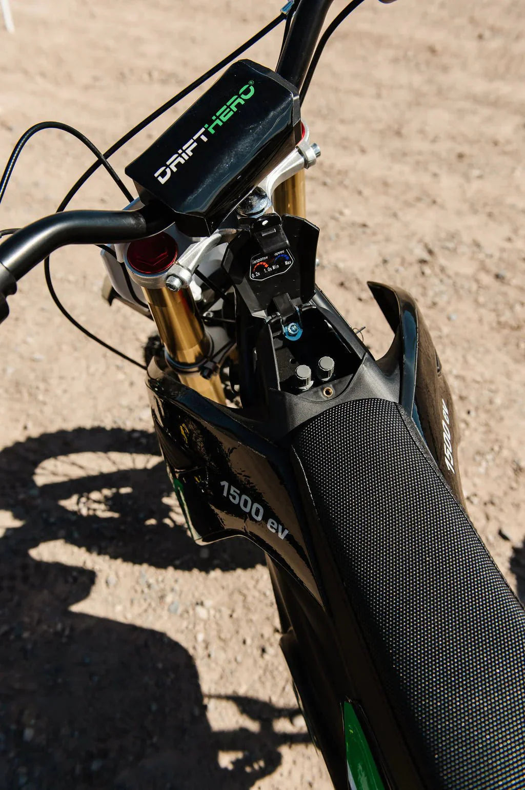 A black eMOTO eBike Drift Hero 1600w dirt bike with rugged tires, sturdy frame, and front suspension, displayed on a white background.