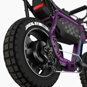 Super73 MZFT eMOTO eBike in black, displayed in-store, side view showing thick tires and minimalist frame design
