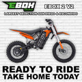 eMOTO Ebox 2 V2 electric bike in orange, side view, displayed against a white background