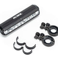 Front view of the eMOTO EBOX Dawn Headlight, showing its compact rectangular design with a clear lens and black housing.