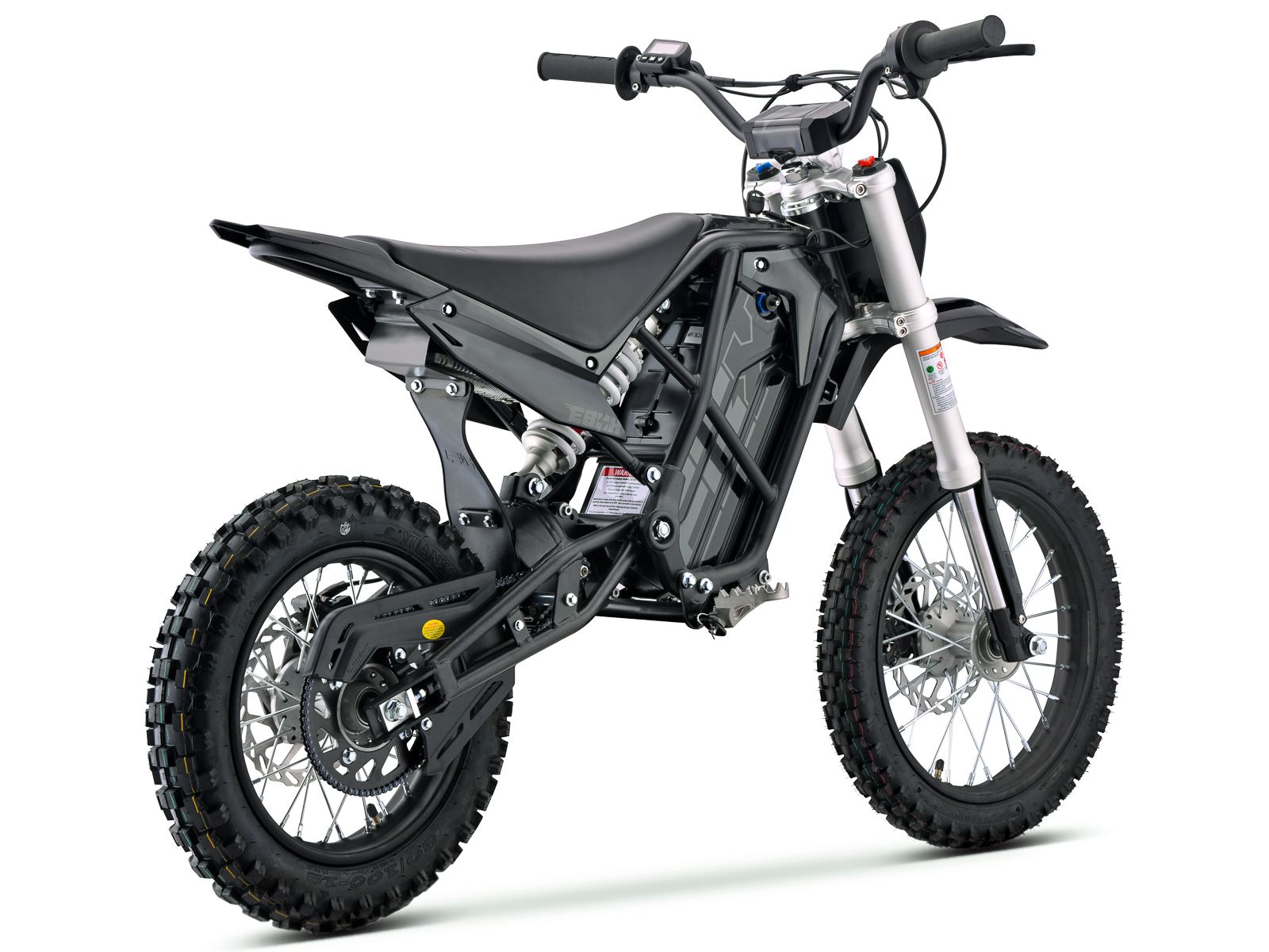 Side view of the eMOTO Stomp Ebox V3 60 electric dirt bike, showcasing its black and green frame, knobby tires, and sturdy suspension system.