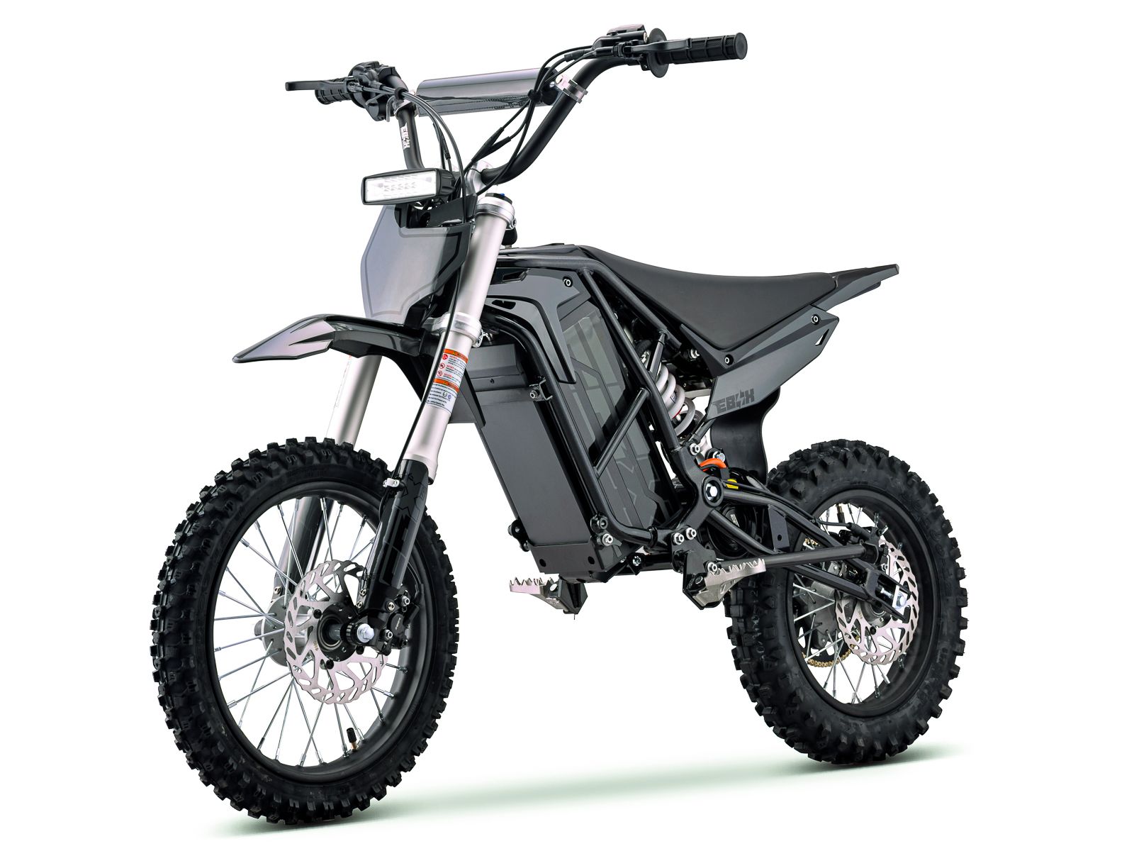 Side view of the eMOTO Stomp Ebox V3 72 RS electric dirt bike in black and green, showing its rugged tires, sturdy frame, and modern design.