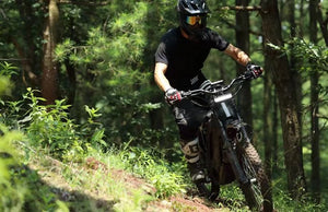 A black eMOTO eRide Pro S electric dirt bike with 3000W/6000W motor, 17x3 off-road tires, and rugged frame, shown on a plain background.