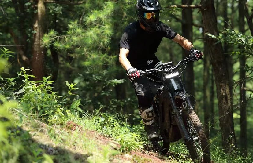 A black eMOTO eRide Pro S electric dirt bike with 3000W/6000W motor, 17x3 off-road tires, and rugged frame, shown on a plain background.