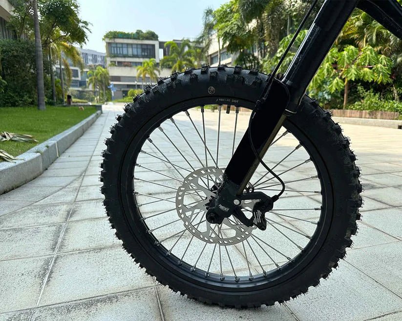 Side view of the eMOTO FREEGO Natkie N1 Electric Dirt Bike, showcasing its rugged off-road tires, sturdy frame, and 4000W motor design.