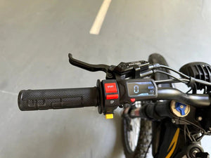 Side view of the eMOTO FREEGO Natkie N1 Electric Dirt Bike in black, showcasing its rugged off-road tires, sturdy frame, and 4000W motor, designed for off-road riding.