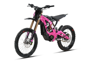 Pink eMOTO Surron Light Bee X electric dirt bike, side view, on a white background