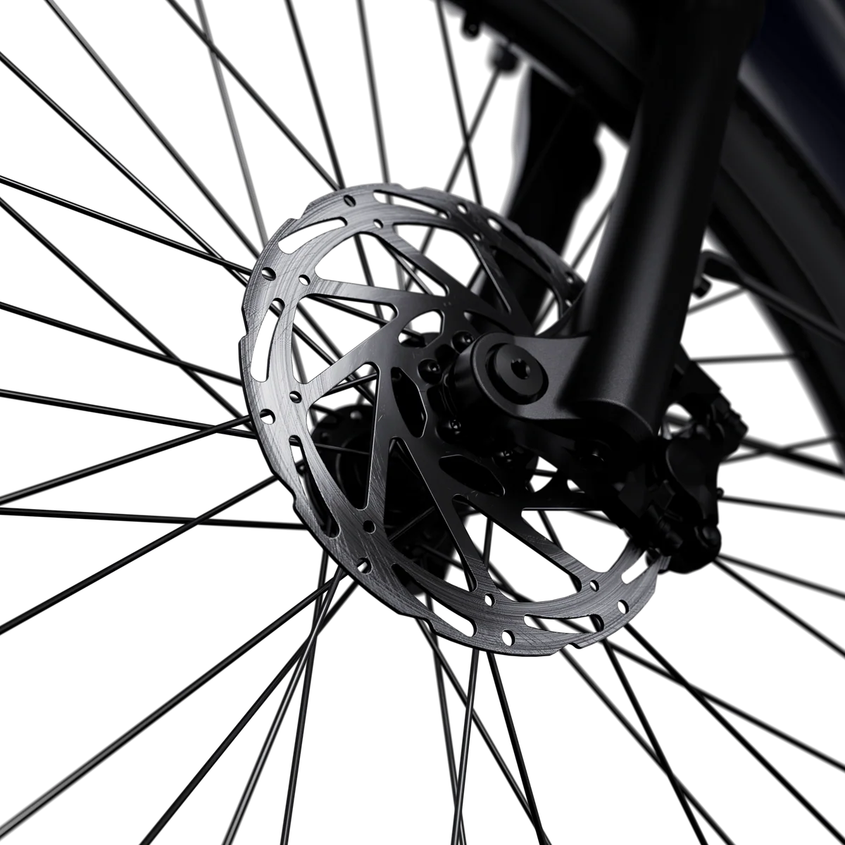 A black Segway Myon eBike parked on a city street, showcasing its sleek frame, integrated battery, and modern design.