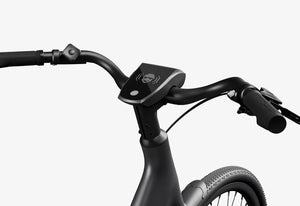 Side view of the Urtopia Carbon 1 Step Thru eBike in matte black, showcasing its lightweight carbon frame, step-through design, and sleek modern styling against a plain background.