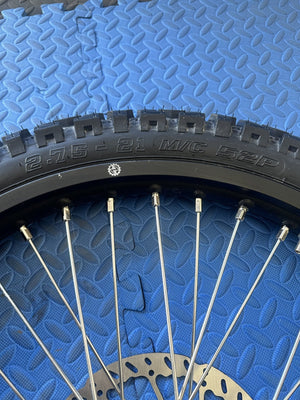 Surron eMoto wheel set with Shinko 244 dual sport 21-inch front wheel and tire for e-moto bikes, shown without rotor or sprocket.