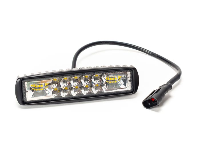Front view of the Stomp Ebox EBX RS headlight showing its rectangular shape, clear lens, and black housing.