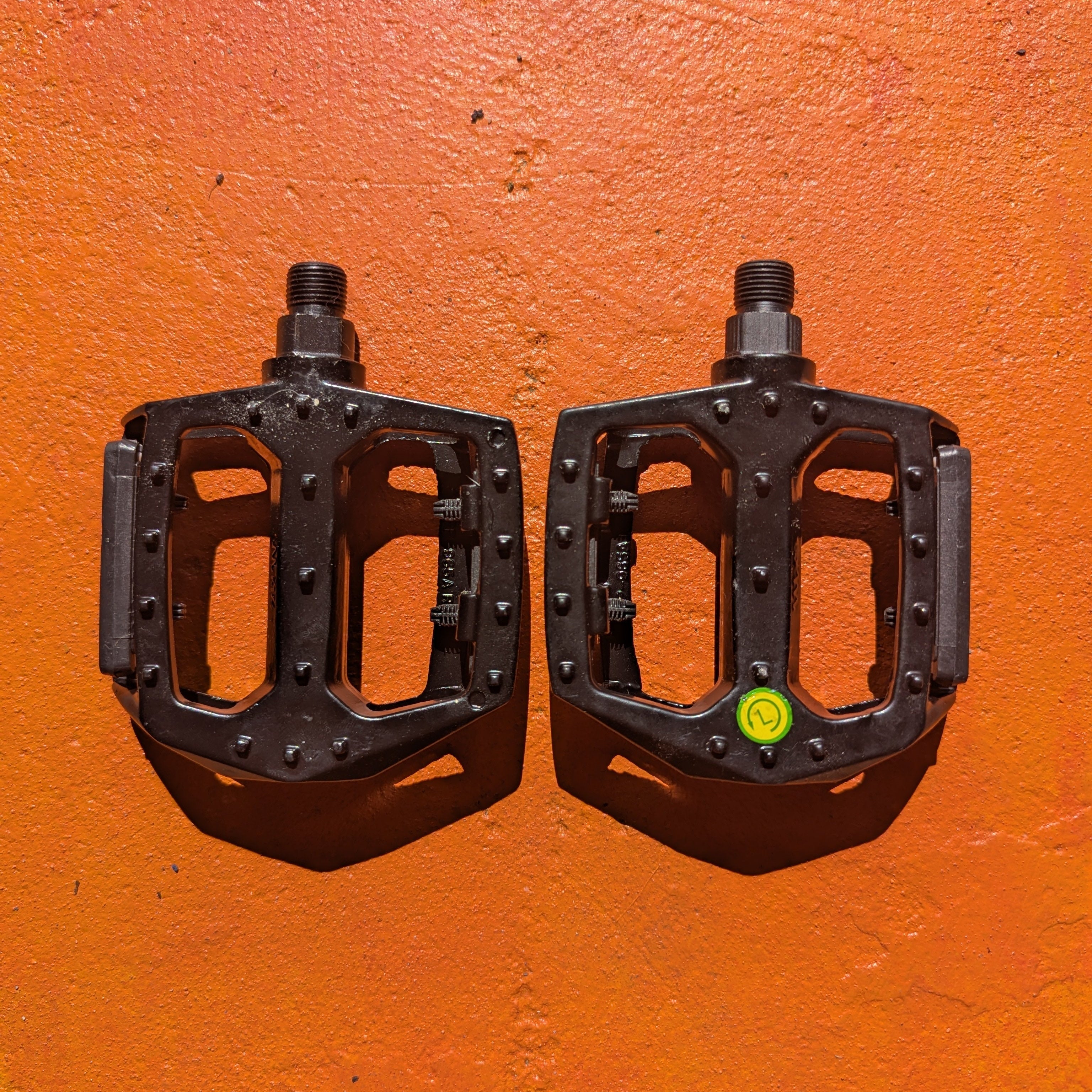 A metal bicycle pedal in Style 3 design, featuring a sleek, durable construction with a textured surface for improved grip.
