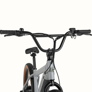 Retrospec Joe Rev BMX eBike in matte feather gray, side view, against a white background