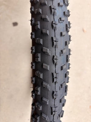 A black eBike with 26x4 inch Chao Yang fat tires, shown in a side profile against a plain background.