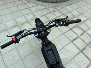 Side view of the eMOTO FREEGO Natkie N1 Electric Dirt Bike, showcasing its rugged off-road tires, sturdy frame, and 4000W motor design.