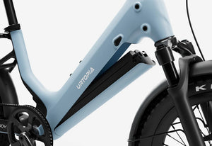 Side view of the Urtopia Carbon Joy eBike in Glacier Blue, showcasing its lightweight carbon frame, sleek design, and integrated battery against a plain background.