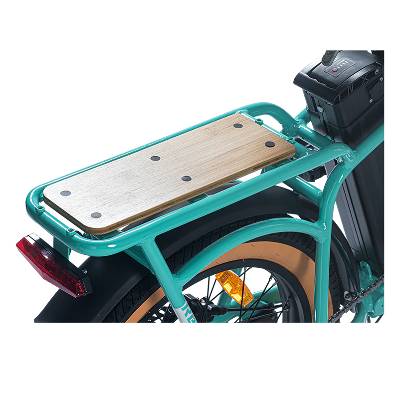 Turquoise E-Bike Revi Rebel 2, side view, showcasing fat tires and step-through frame