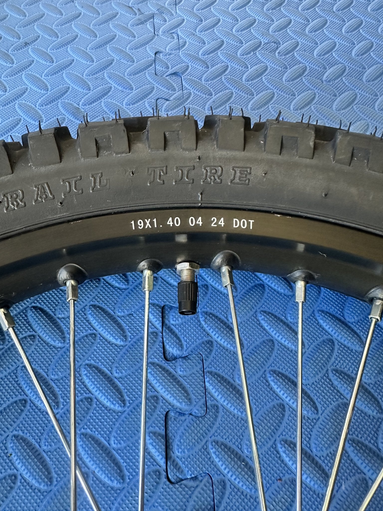 Surron eMoto 19-inch front wheel and Shinko 244 dual sport tire set for e-moto bikes, shown without rotor or sprocket.