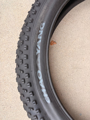A black eBike with 26x4 inch Chao Yang fat tires, shown from a side angle against a white background.