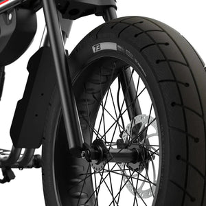 Side view of the eMOTO eBike Super73 ZX Core in a showroom, highlighting its sturdy frame, wide tires, and minimalist design.
