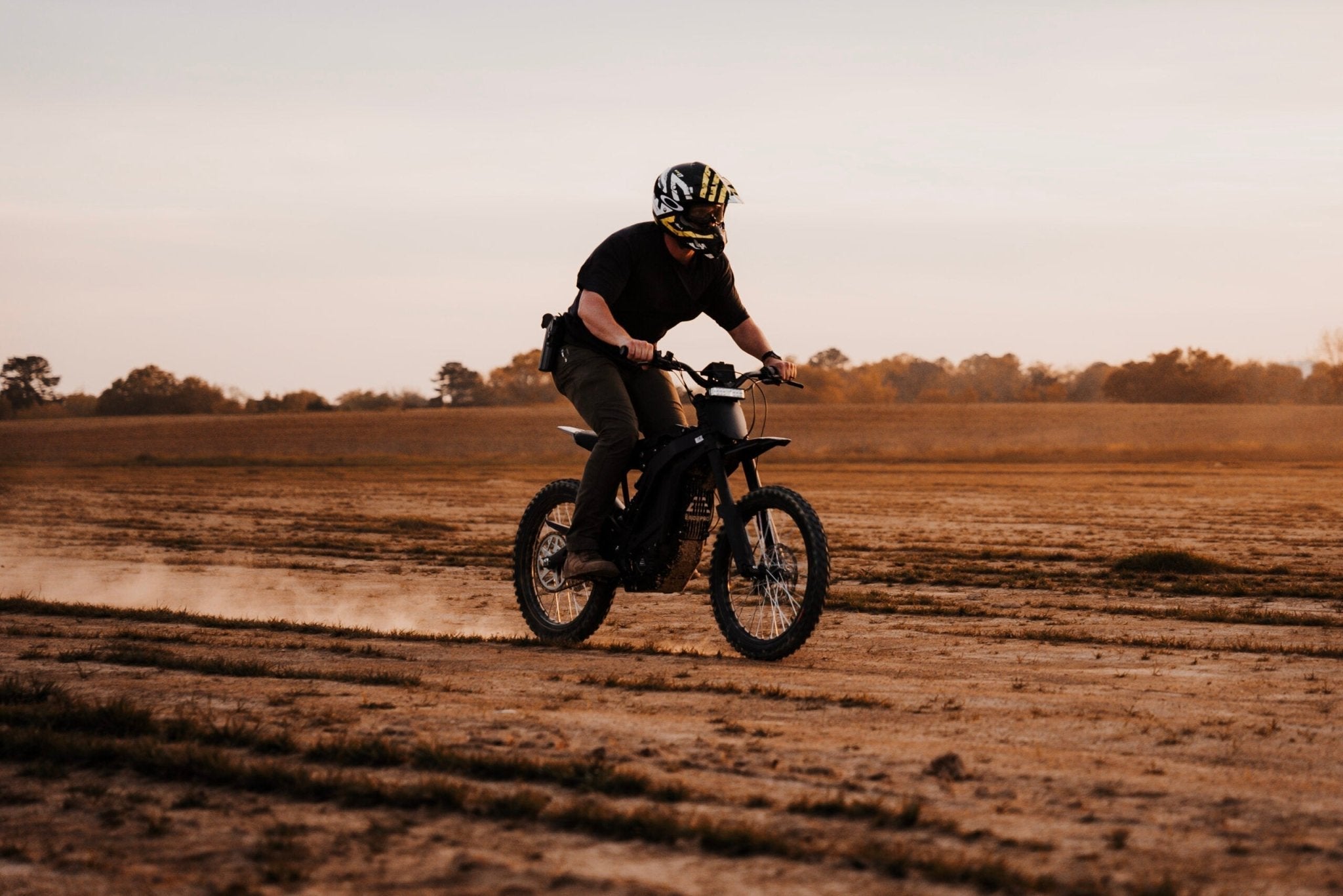 eMOTO eRide Pro SS 2.0 electric dirt bike in black, featuring 19x3 off-road tires, robust frame, and sporty design, displayed on a white background.