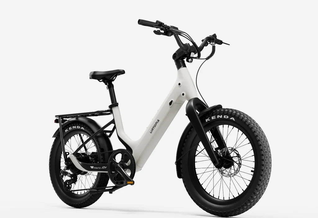Side view of the Urtopia Carbon Joy Ultra eBike in creme color, showcasing its lightweight carbon frame, sleek design, and integrated battery against a plain background.