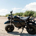 A black and red eBike Drift Hero 1500w Mini electric bike with thick tires, compact frame, and sporty design, displayed on a white background.