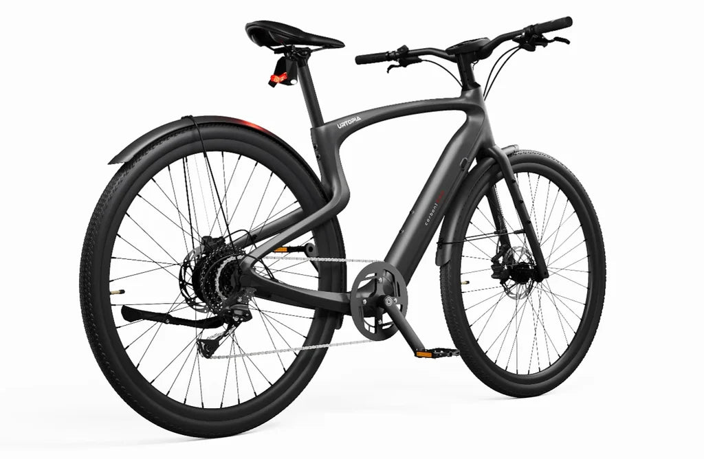 Side view of the Urtopia Carbon 1 Pro eBike in matte black, showcasing its sleek carbon fiber frame, integrated display, and minimalist design against a plain background.