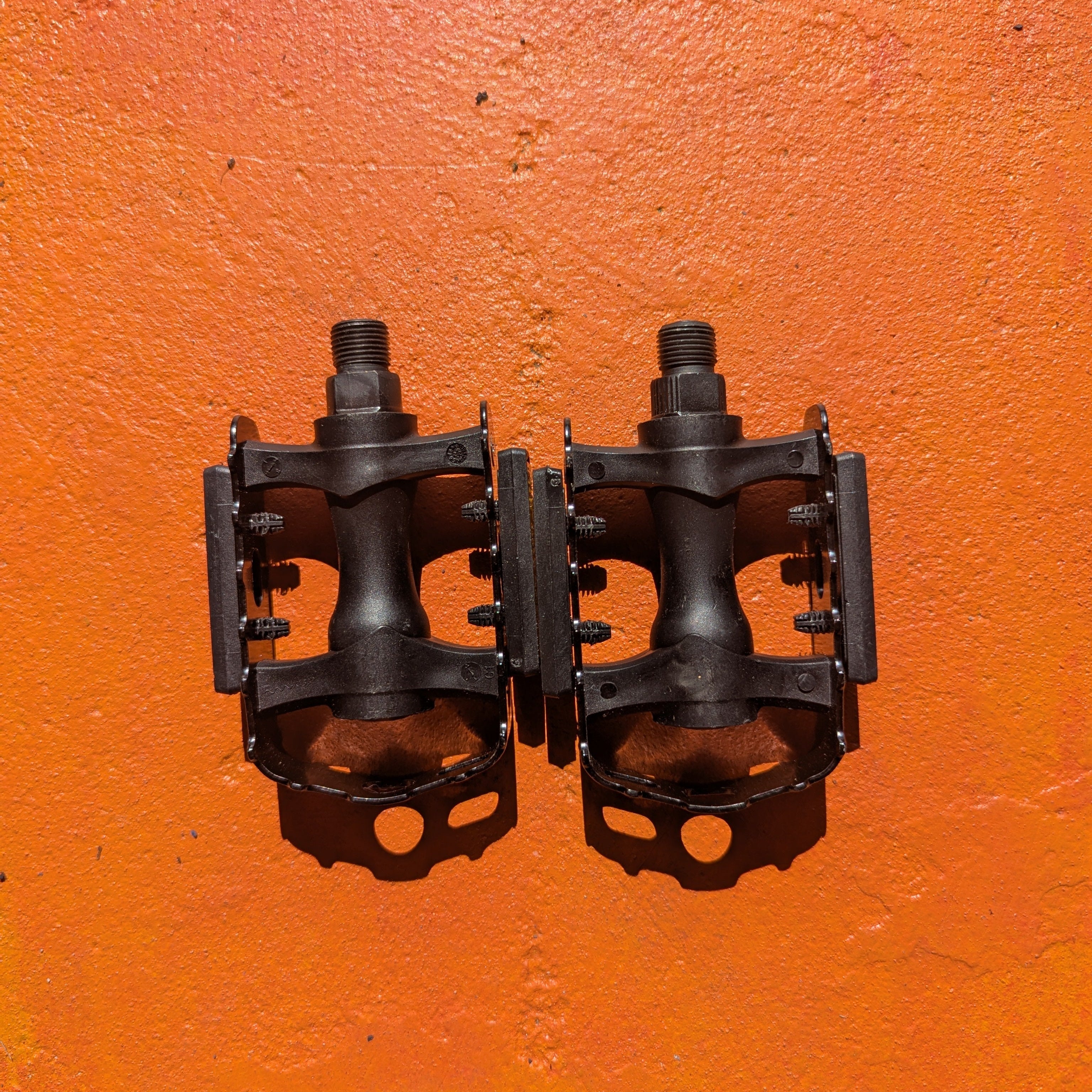 Metal eBike pedals, Style 5, featuring a sturdy design with textured surface and multiple grip pins, shown in a close-up product image.