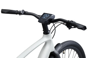 Side view of the Urtopia Carbon 1 Pro eBike in creme color, showcasing its lightweight carbon frame, sleek design, and integrated components against a plain background.
