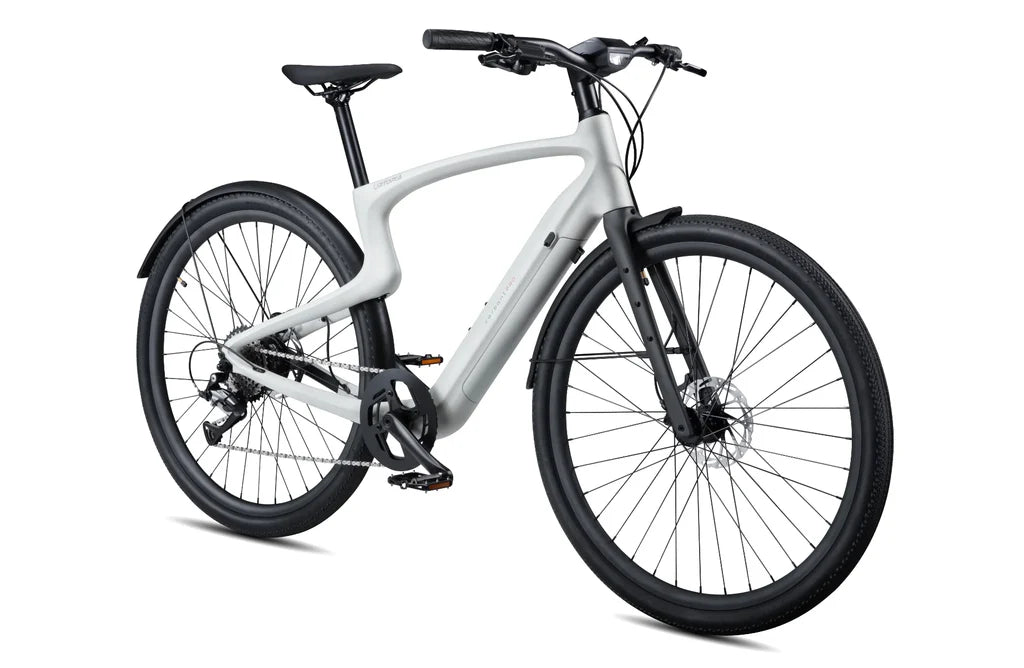 Side view of the Urtopia Carbon 1 Pro eBike in creme color, showcasing its lightweight carbon frame, sleek design, and integrated display on the handlebars.
