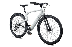 Side view of the Urtopia Carbon 1 Pro eBike in creme color, showcasing its lightweight carbon frame, sleek design, and integrated display on the handlebars.