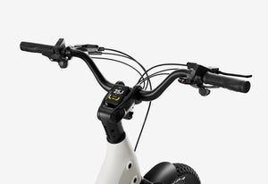 Side view of the Urtopia Carbon Joy eBike in creme color, showcasing its lightweight carbon frame, sleek design, and integrated battery against a plain background.