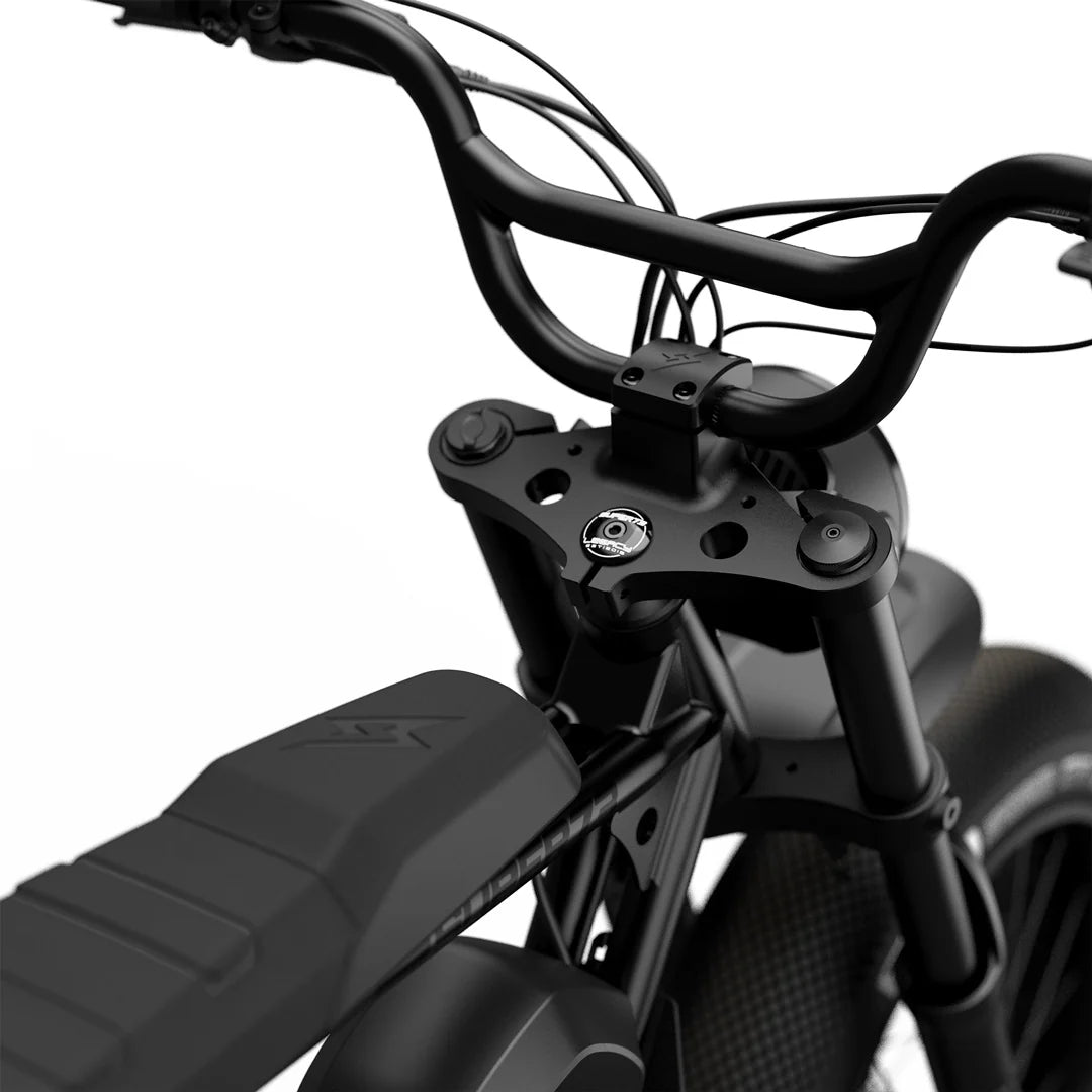 Side view of the Super73 S2 SE electric bike in black, showcasing its thick tires, elongated seat, and minimalist frame design against a plain background.