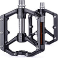 Black alloy eBike pedals with built-in reflectors, product image on white background