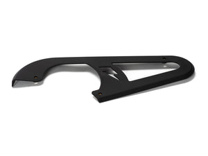 Stomp Ebox Dragster chain guard, black metal component mounted on a motorcycle frame, shown from a side angle against a white background.