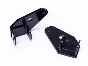 Close-up view of the Stomp Ebox Dragster foot peg mount, showing the metal bracket and mounting hardware against a plain background.